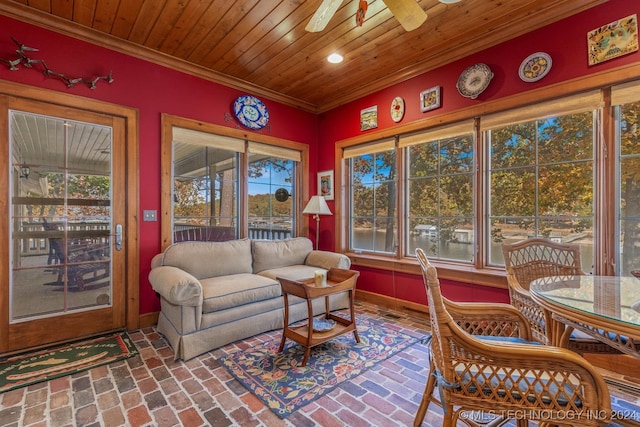 sunroom featuring a healthy amount of sunlight and ceiling fan