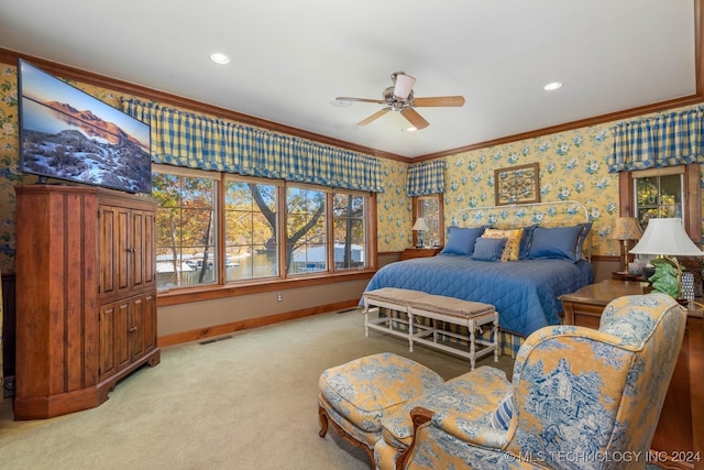 bedroom with ceiling fan, crown molding, and carpet