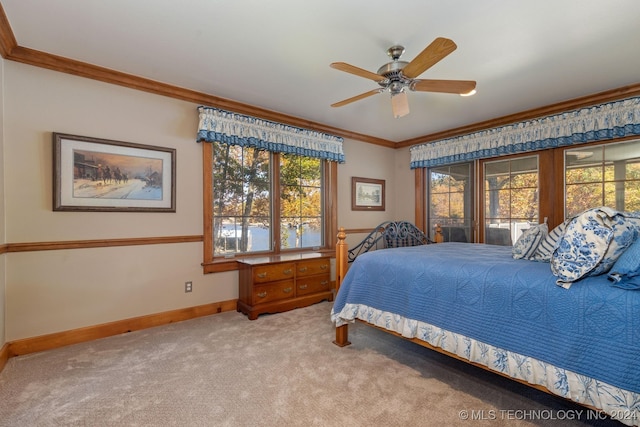 bedroom featuring ornamental molding, carpet floors, and ceiling fan