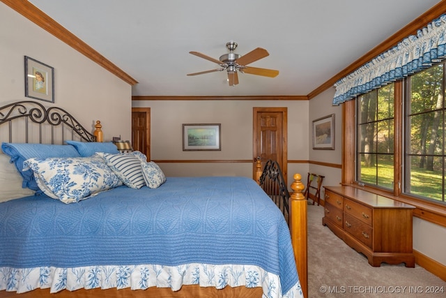 bedroom featuring ceiling fan, ornamental molding, and light colored carpet