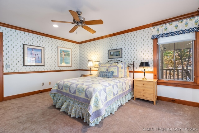 bedroom featuring ornamental molding, carpet flooring, and ceiling fan