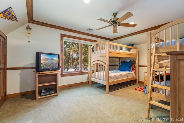 bedroom with ornamental molding, carpet flooring, lofted ceiling, and ceiling fan