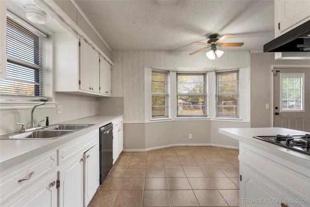 kitchen featuring sink, white cabinets, and light tile patterned floors