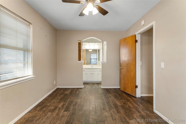 empty room featuring sink, dark hardwood / wood-style floors, and ceiling fan