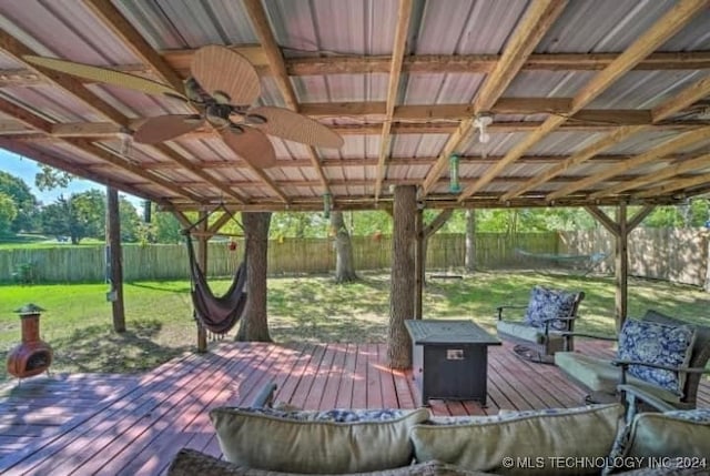 wooden terrace with a yard and ceiling fan