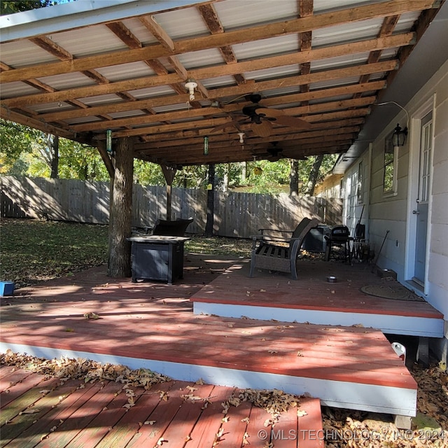 wooden deck featuring ceiling fan