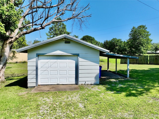 garage with a yard