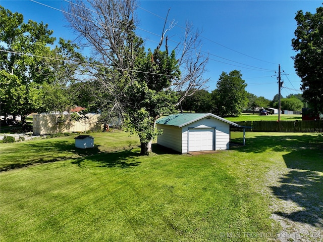 view of yard with an outbuilding and a garage