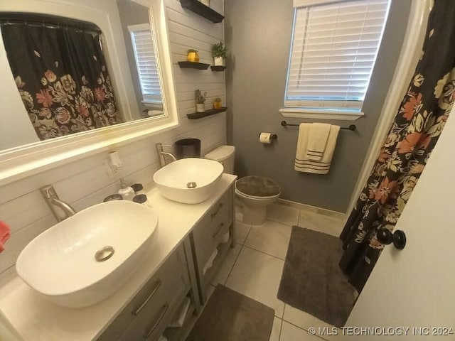 bathroom with vanity, toilet, and tile patterned flooring