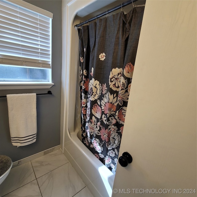 bathroom featuring shower / bath combination with curtain