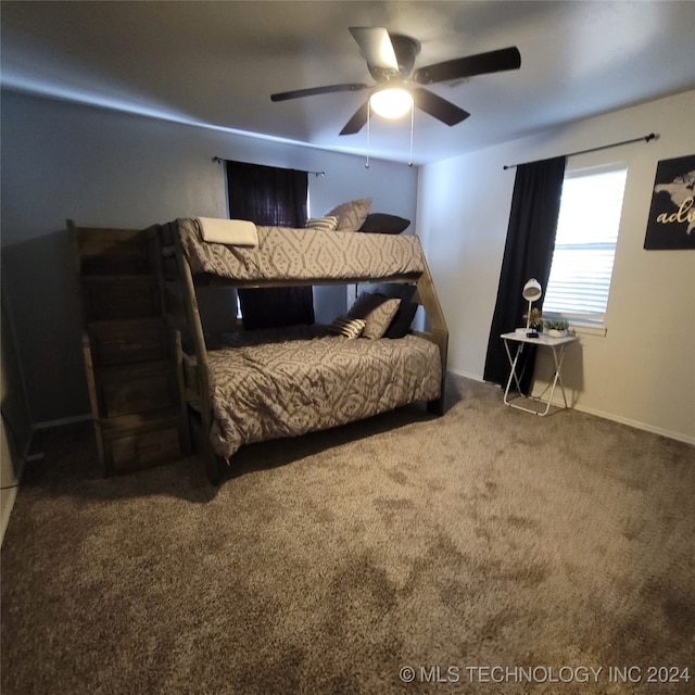 bedroom with ceiling fan and carpet floors