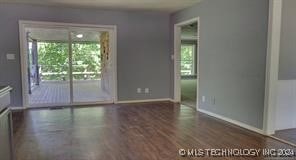 spare room featuring dark hardwood / wood-style flooring