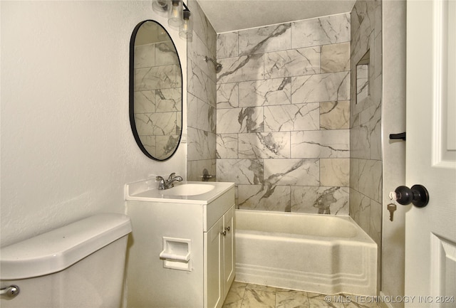 full bathroom with vanity, toilet, and tiled shower / bath combo