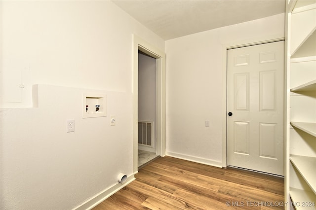 washroom featuring hookup for a washing machine and wood-type flooring