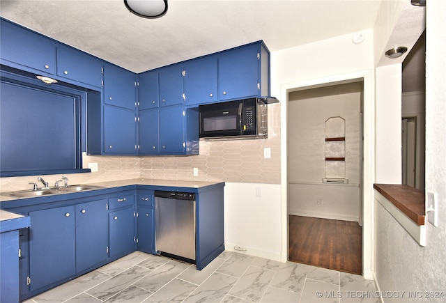 kitchen featuring tasteful backsplash, blue cabinets, dishwasher, light hardwood / wood-style floors, and sink