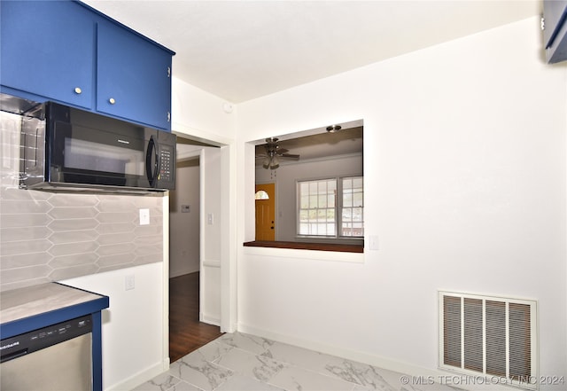 kitchen with blue cabinetry, dishwasher, ceiling fan, and dark hardwood / wood-style floors