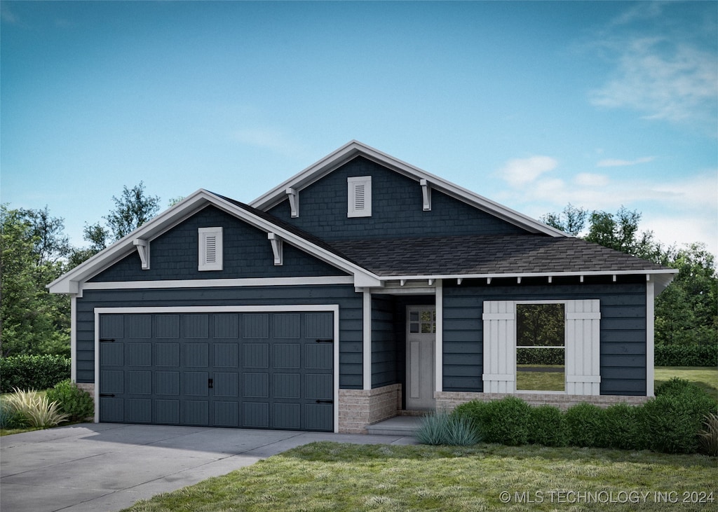 view of front of house with a front lawn and a garage