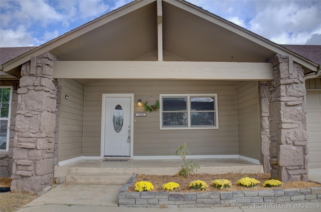 property entrance featuring covered porch