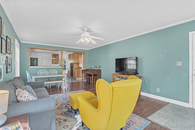 living room featuring crown molding, hardwood / wood-style flooring, and ceiling fan