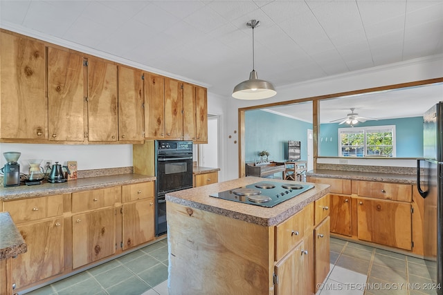 kitchen featuring a kitchen island, black appliances, crown molding, light tile patterned flooring, and pendant lighting