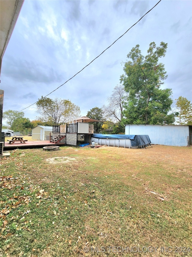 view of yard featuring a pool side deck