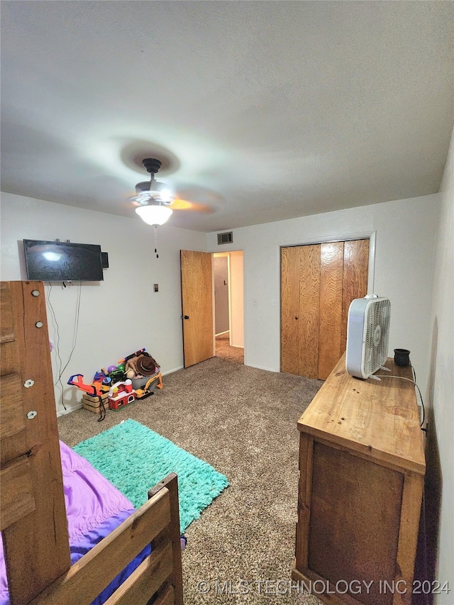 carpeted bedroom featuring ceiling fan