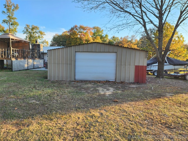 garage featuring a lawn