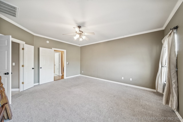 unfurnished bedroom with light carpet, ornamental molding, and ceiling fan