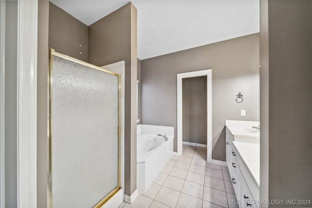 bathroom featuring vanity, independent shower and bath, and tile patterned flooring