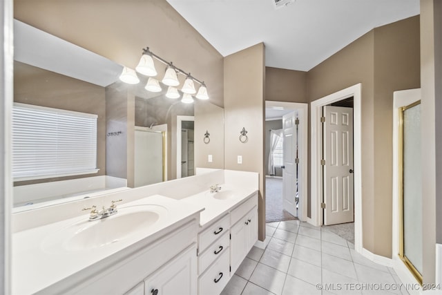 bathroom with vanity, plus walk in shower, and tile patterned floors