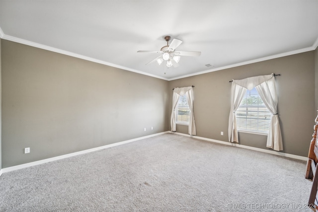 carpeted empty room with crown molding and ceiling fan