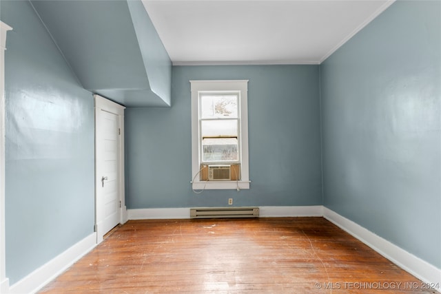 bonus room featuring baseboard heating, cooling unit, and light hardwood / wood-style floors