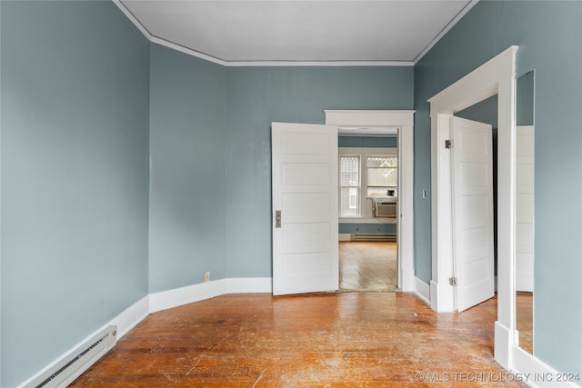 unfurnished room featuring ornamental molding, a baseboard radiator, and light wood-type flooring