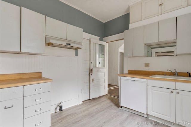 kitchen featuring white dishwasher, ornamental molding, sink, light wood-type flooring, and white cabinetry