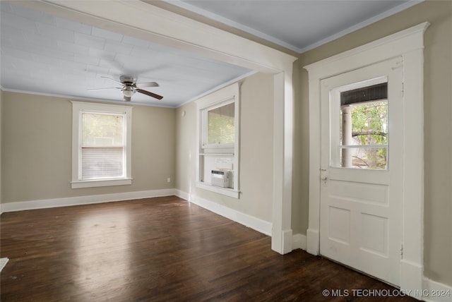 foyer entrance with ceiling fan, crown molding, and dark hardwood / wood-style floors