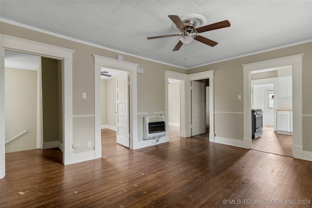 unfurnished living room featuring crown molding, dark wood-type flooring, heating unit, and ceiling fan