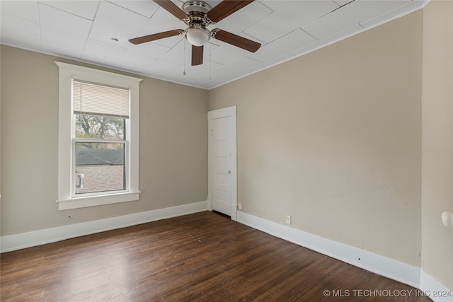 spare room featuring ceiling fan, crown molding, and dark hardwood / wood-style flooring