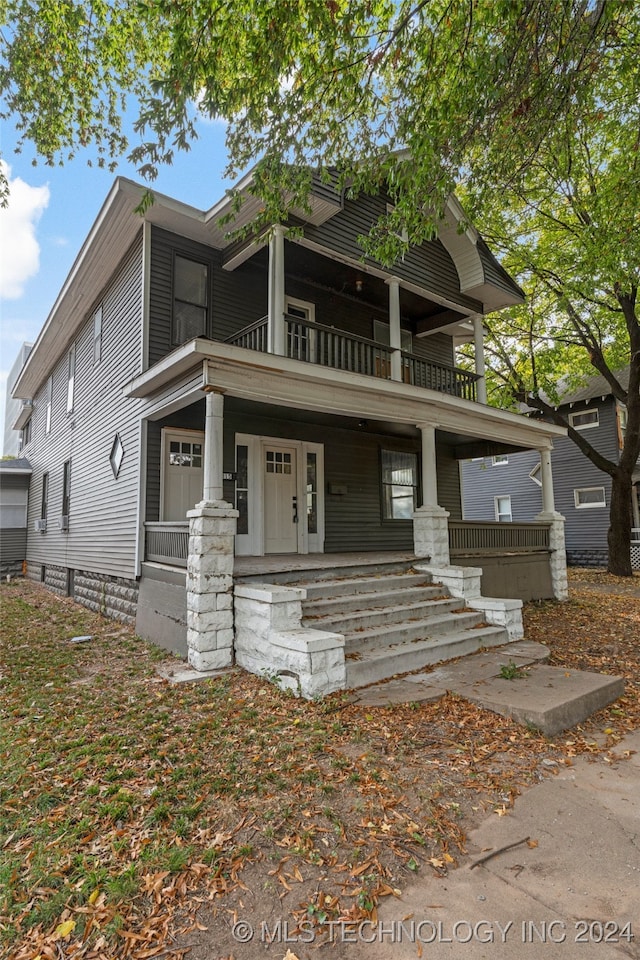 view of front of home with a balcony and covered porch