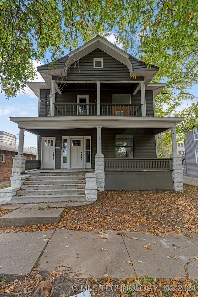 view of front of home featuring a porch and a balcony