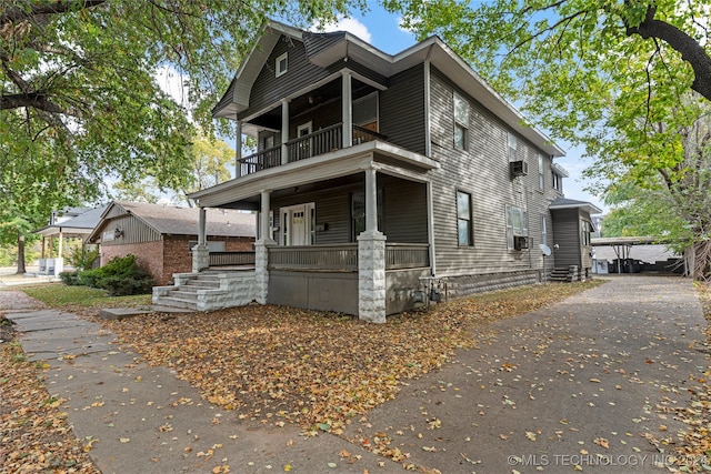 view of front of home with a balcony and covered porch