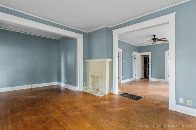 unfurnished living room with crown molding, hardwood / wood-style flooring, and ceiling fan