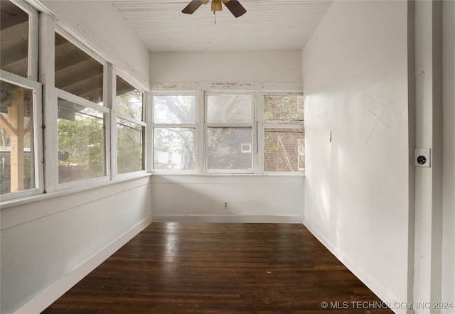 unfurnished sunroom featuring ceiling fan