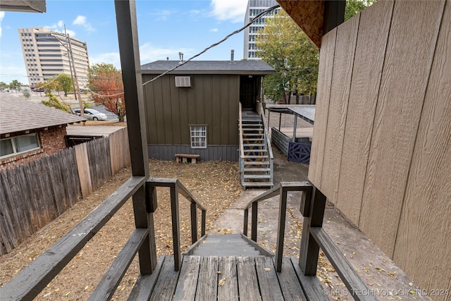 view of side of property with a wooden deck