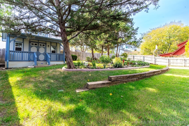 view of yard featuring a porch