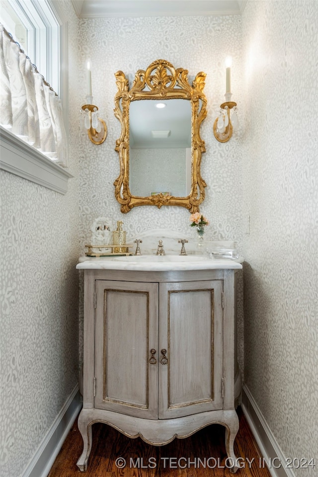 bathroom with vanity and hardwood / wood-style flooring