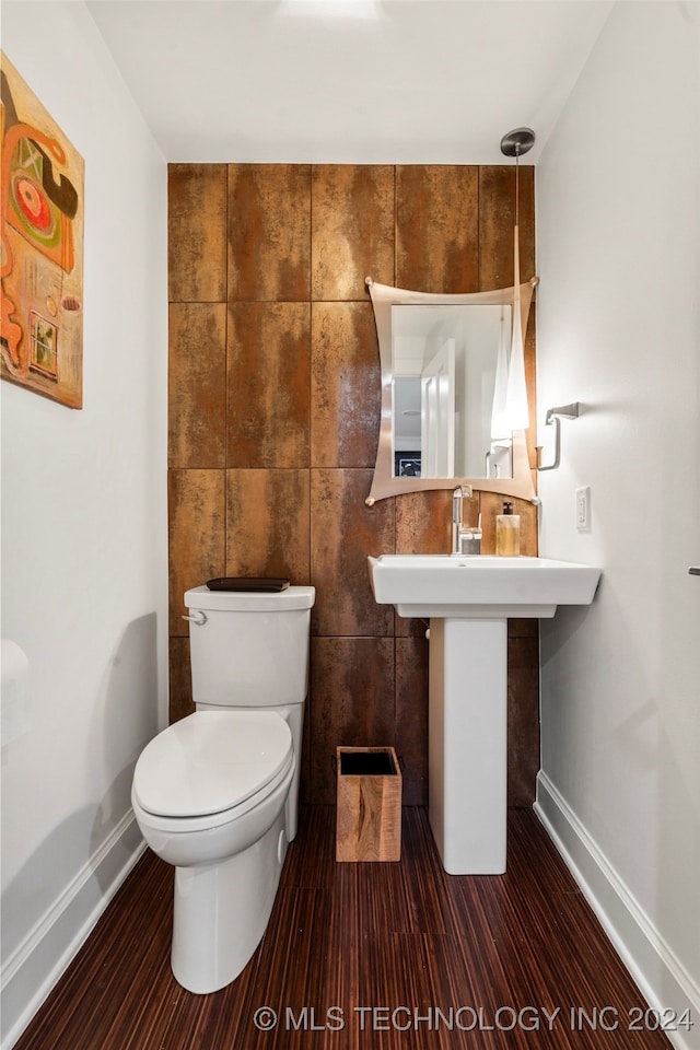 bathroom featuring toilet and hardwood / wood-style floors