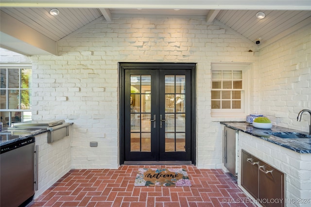 property entrance with french doors, area for grilling, and sink