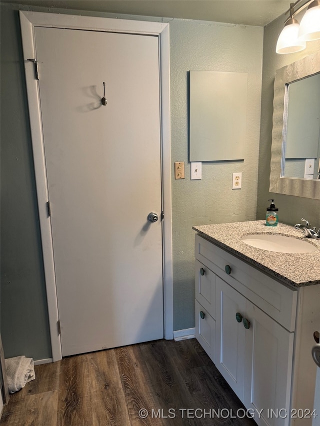 bathroom featuring vanity and wood-type flooring