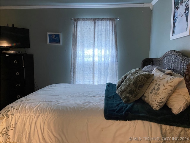 bedroom with crown molding