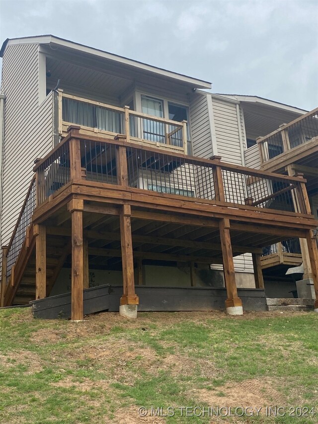 125 Falconhead Unit E, Burneyville, OK 73430 - back of property with a deck